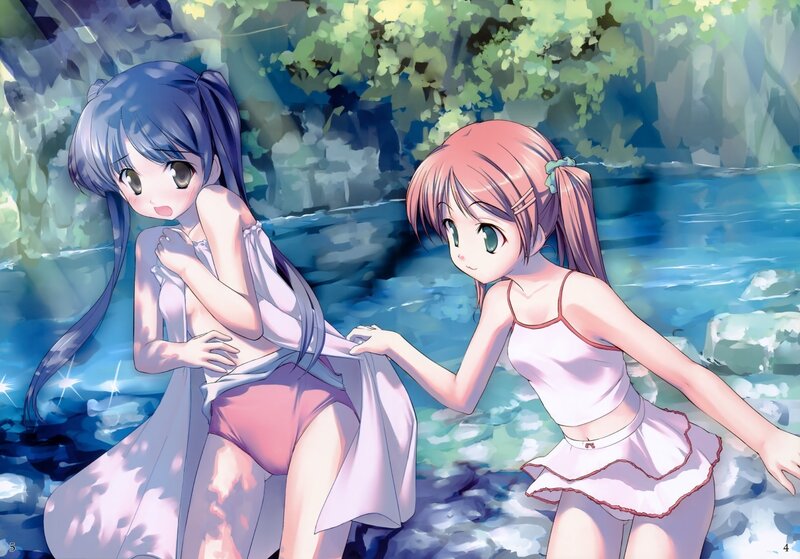 Two girls by a stream