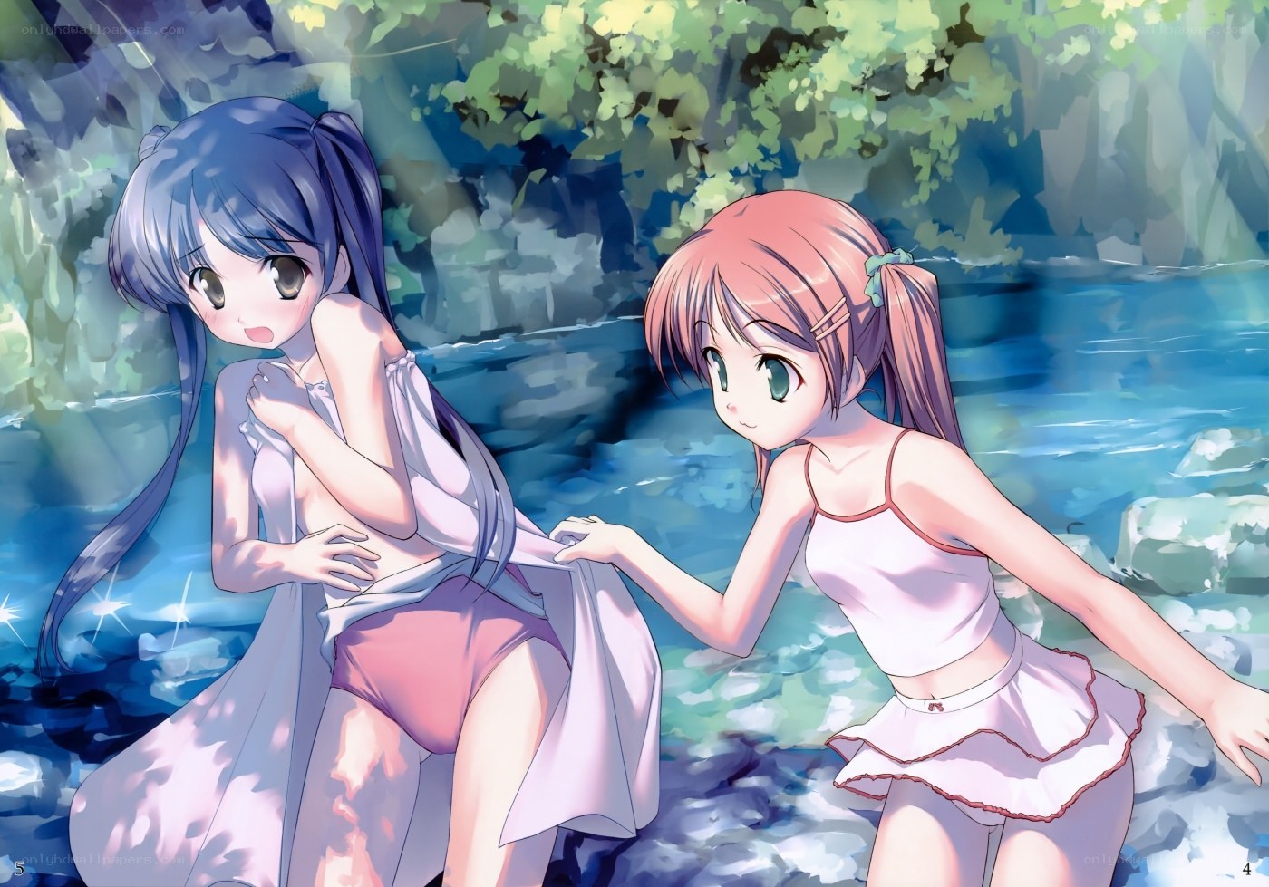 Two girls by a stream