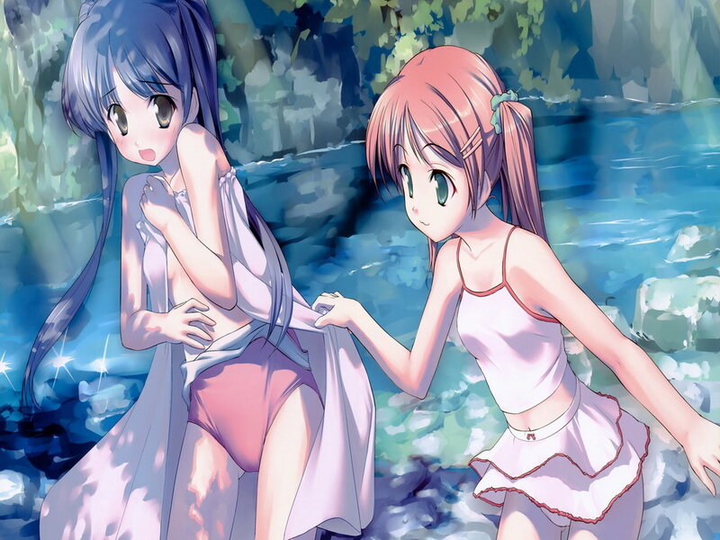 Two girls by a stream