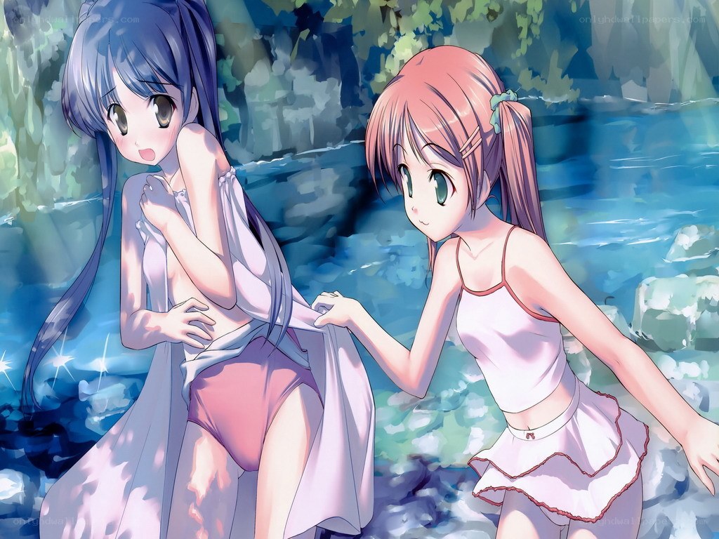 Two girls by a stream