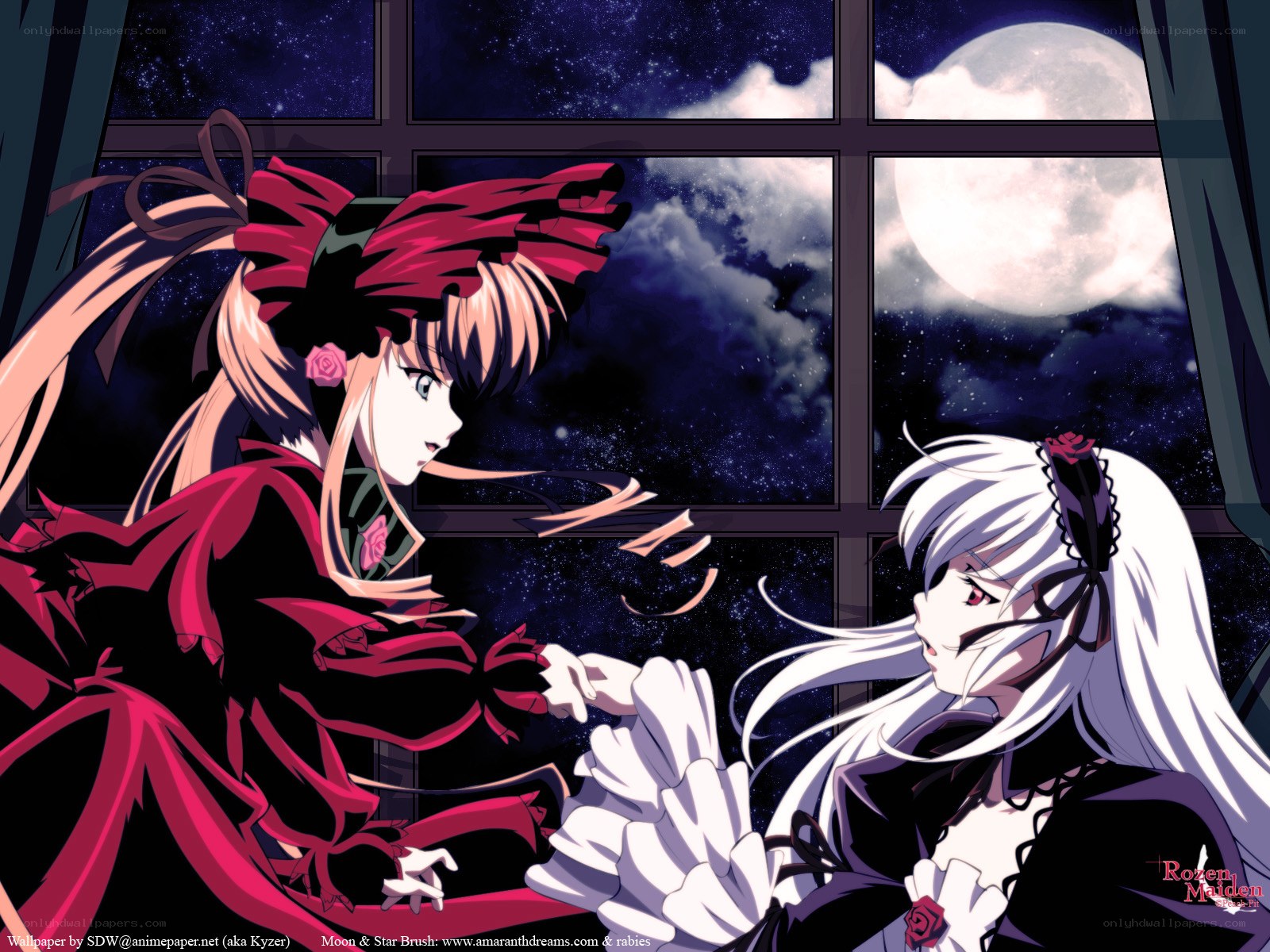 Two girls by a window at night