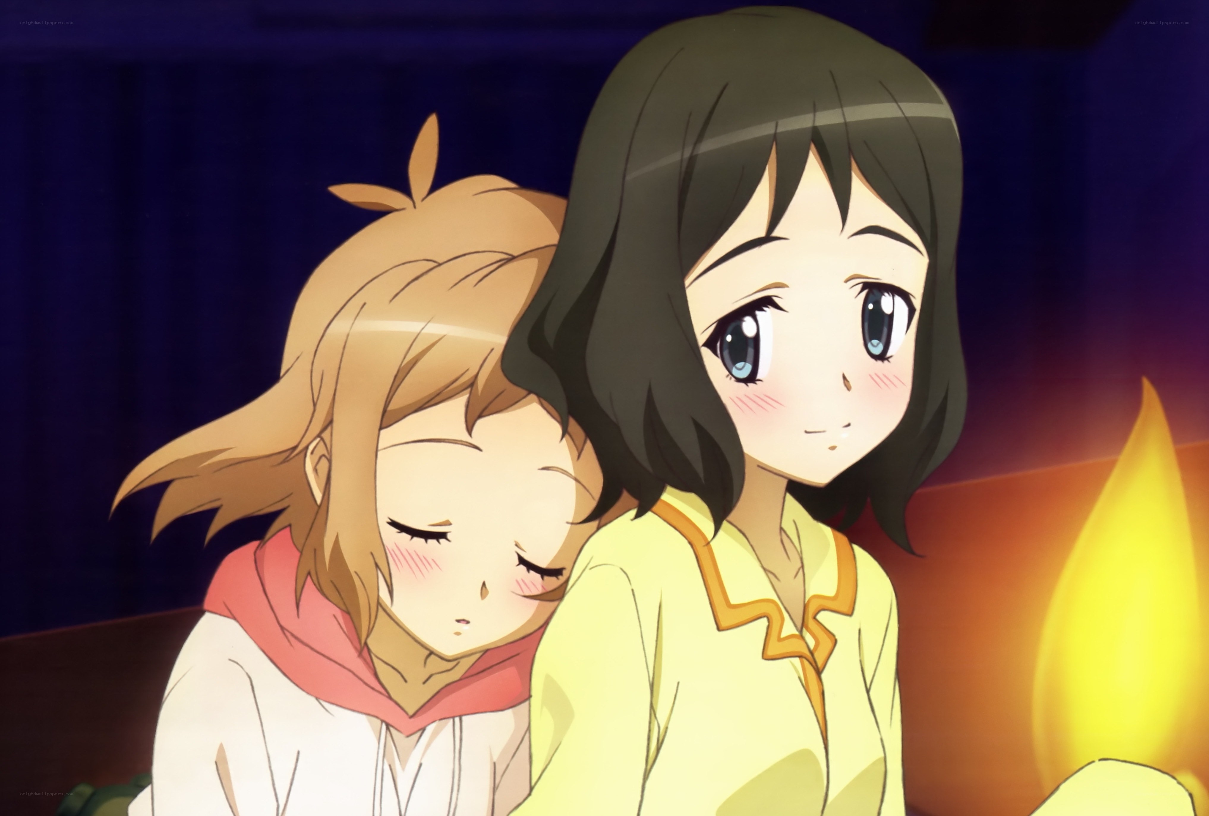 Two girls by candlelight