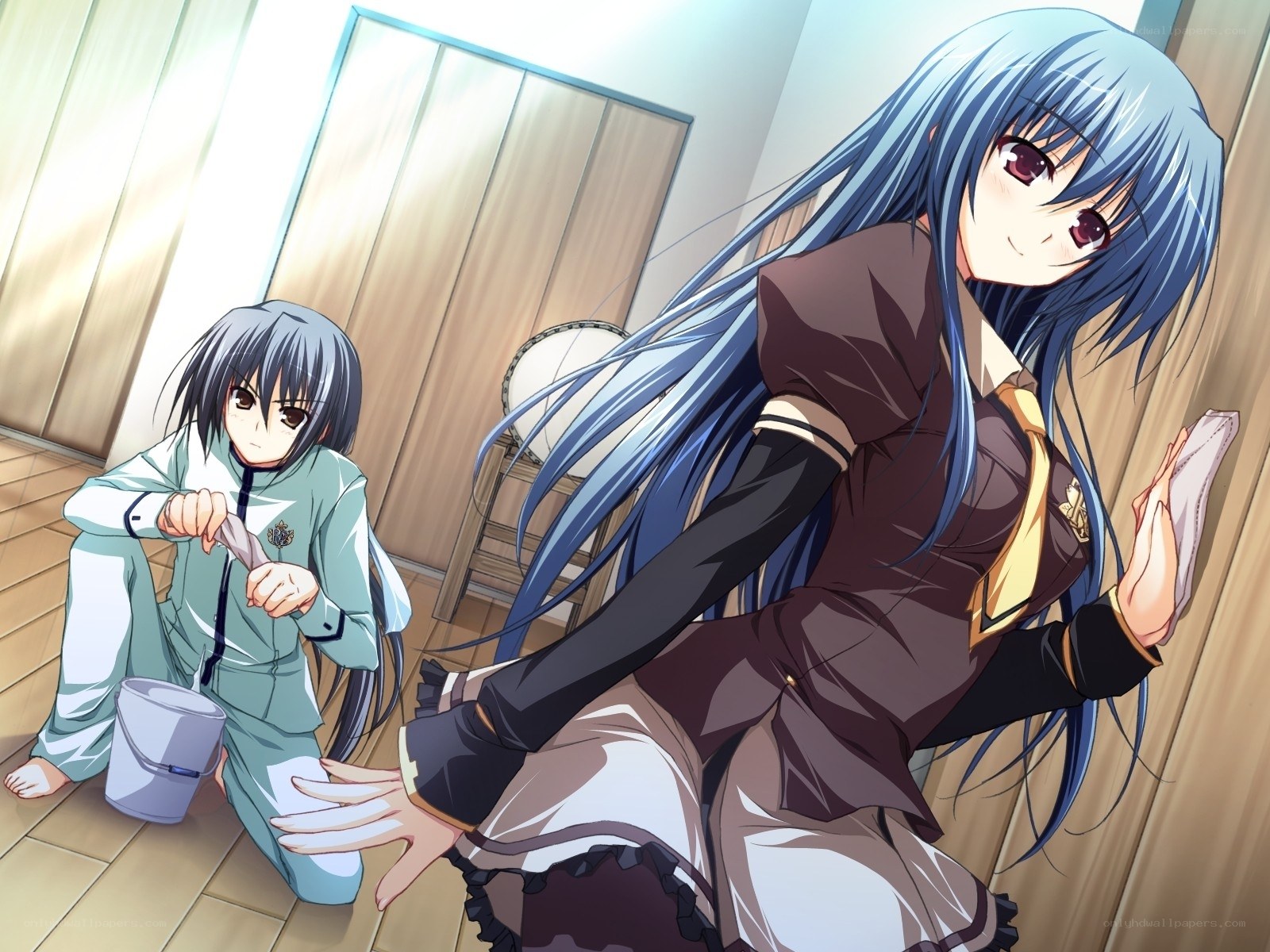 Two girls cleaning a room
