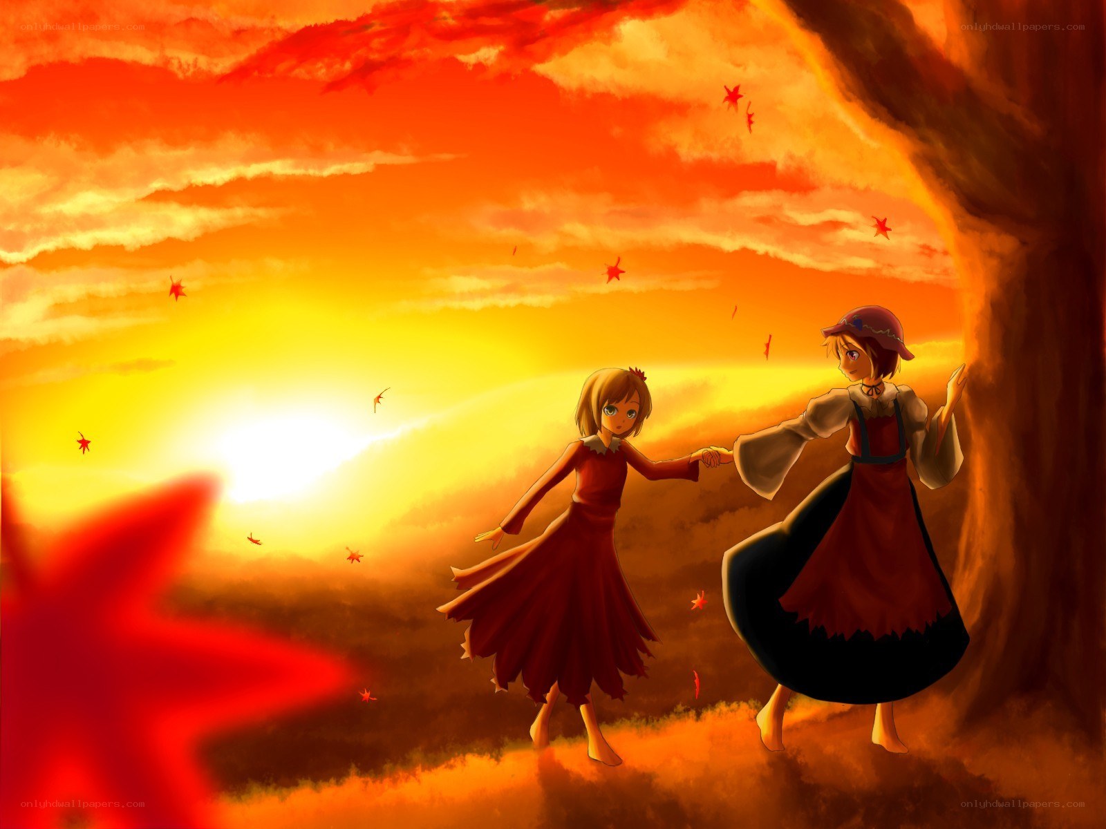 Two girls dancing at sunset