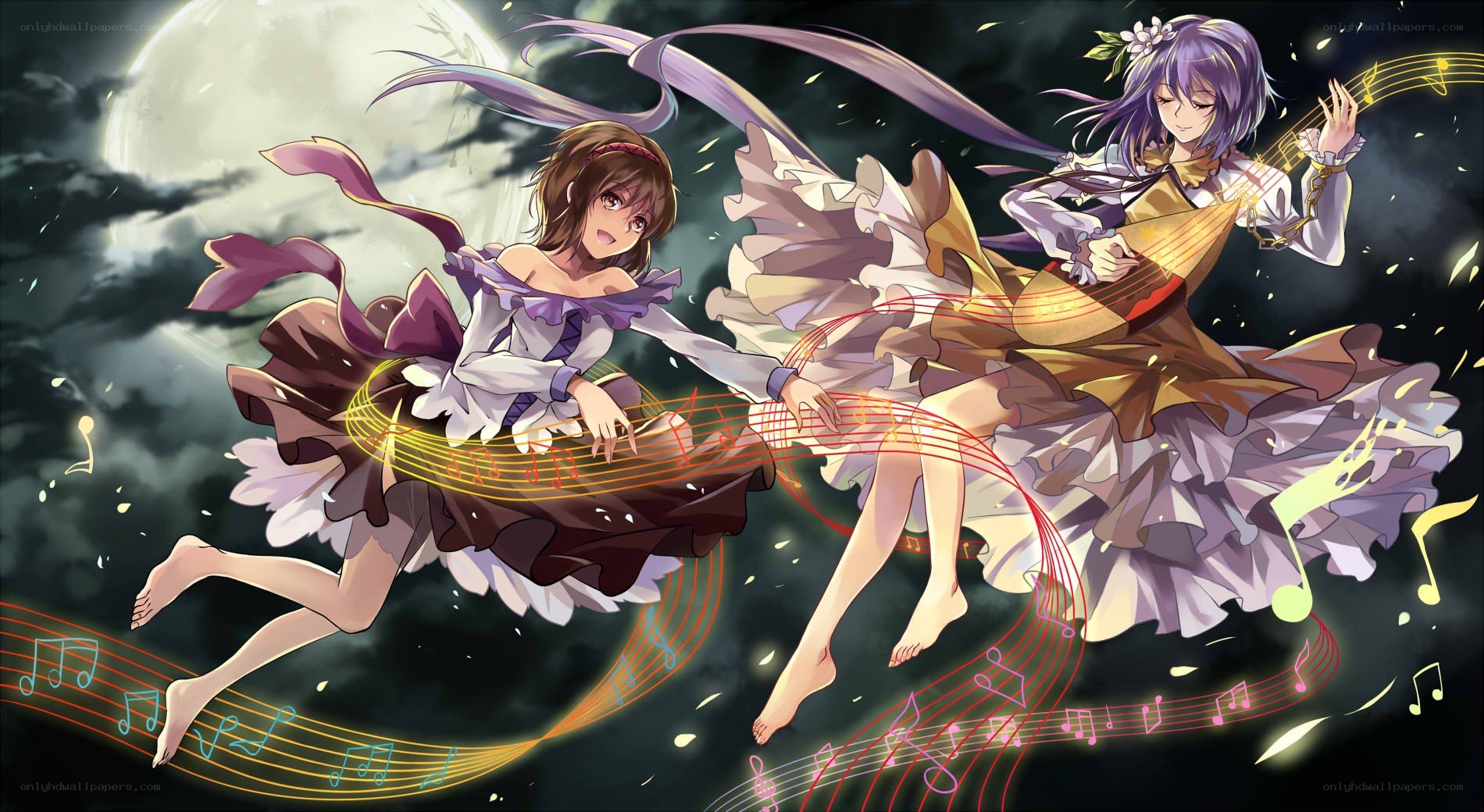 Two girls dancing with music
