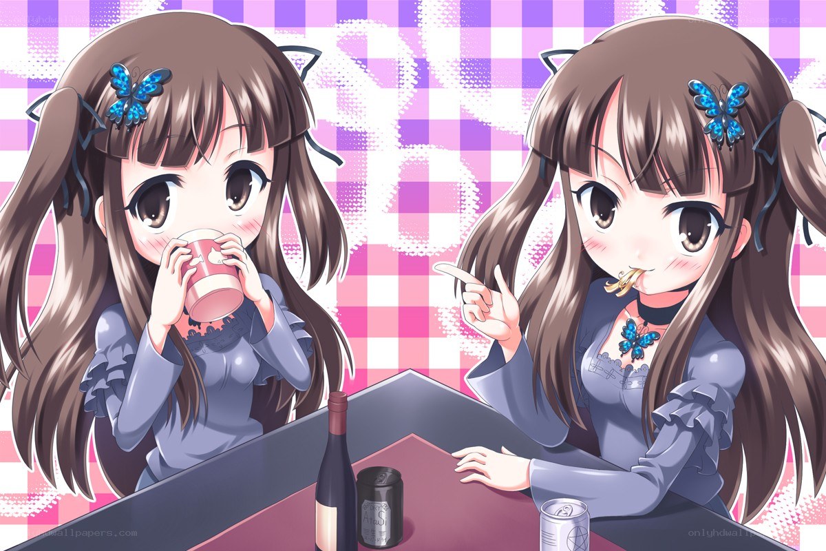 Two girls drinking at a table