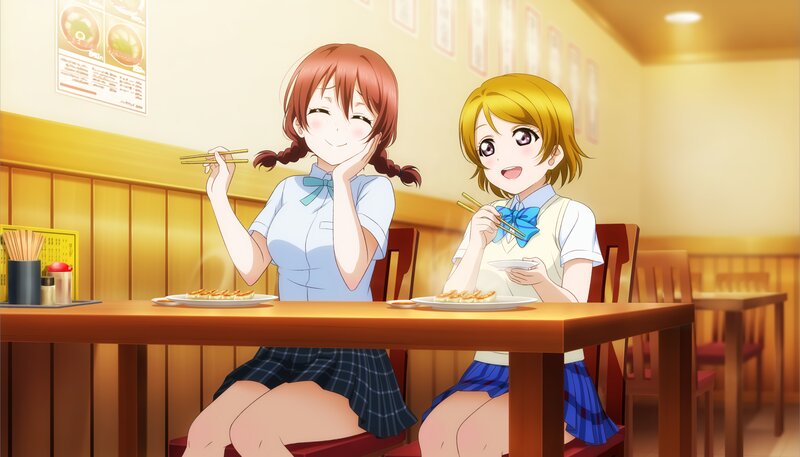Two Girls Eating at a Table