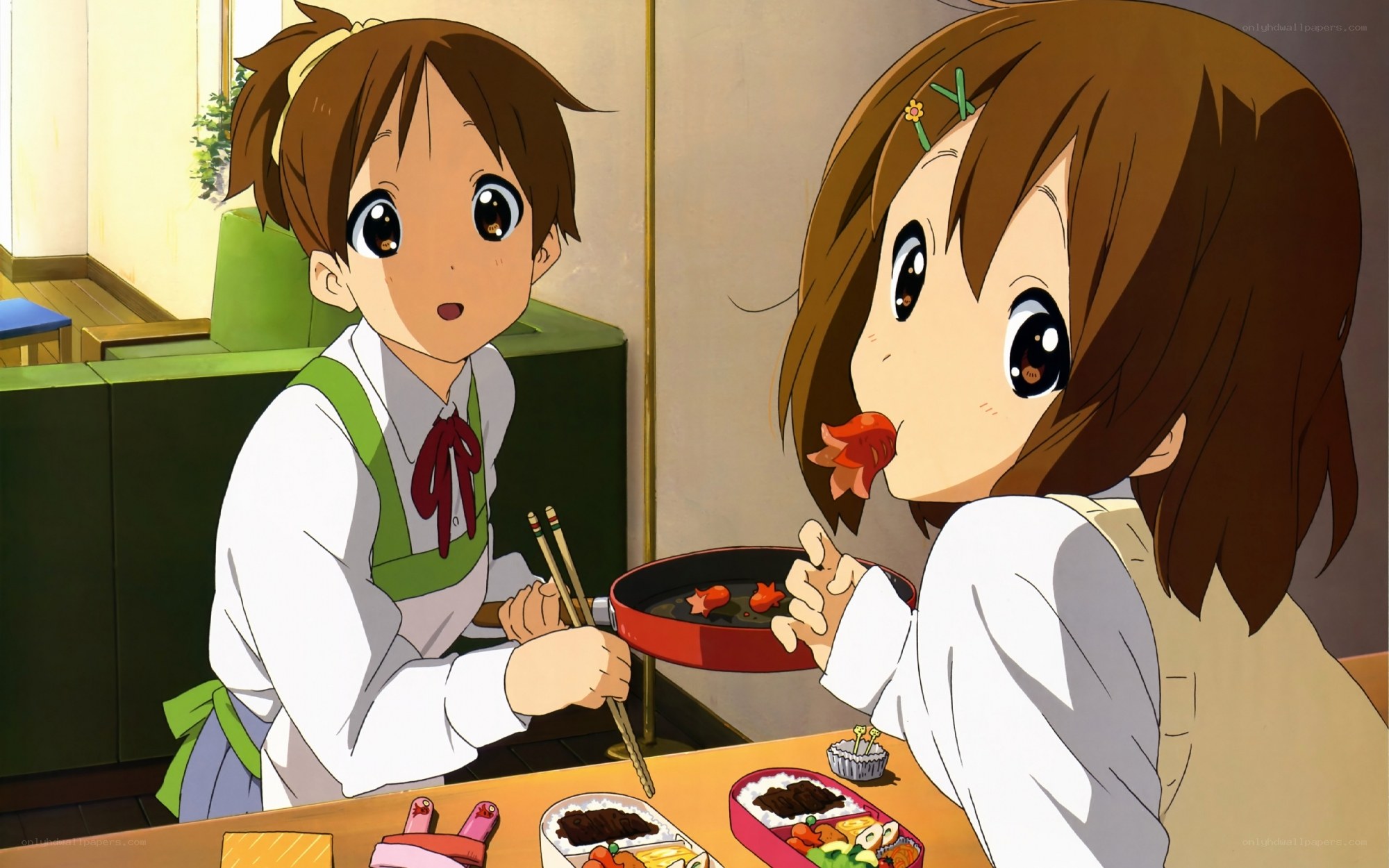 Two girls eating bento boxes