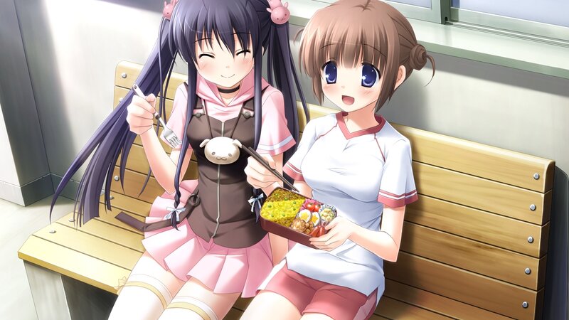 Two girls eating bento boxes