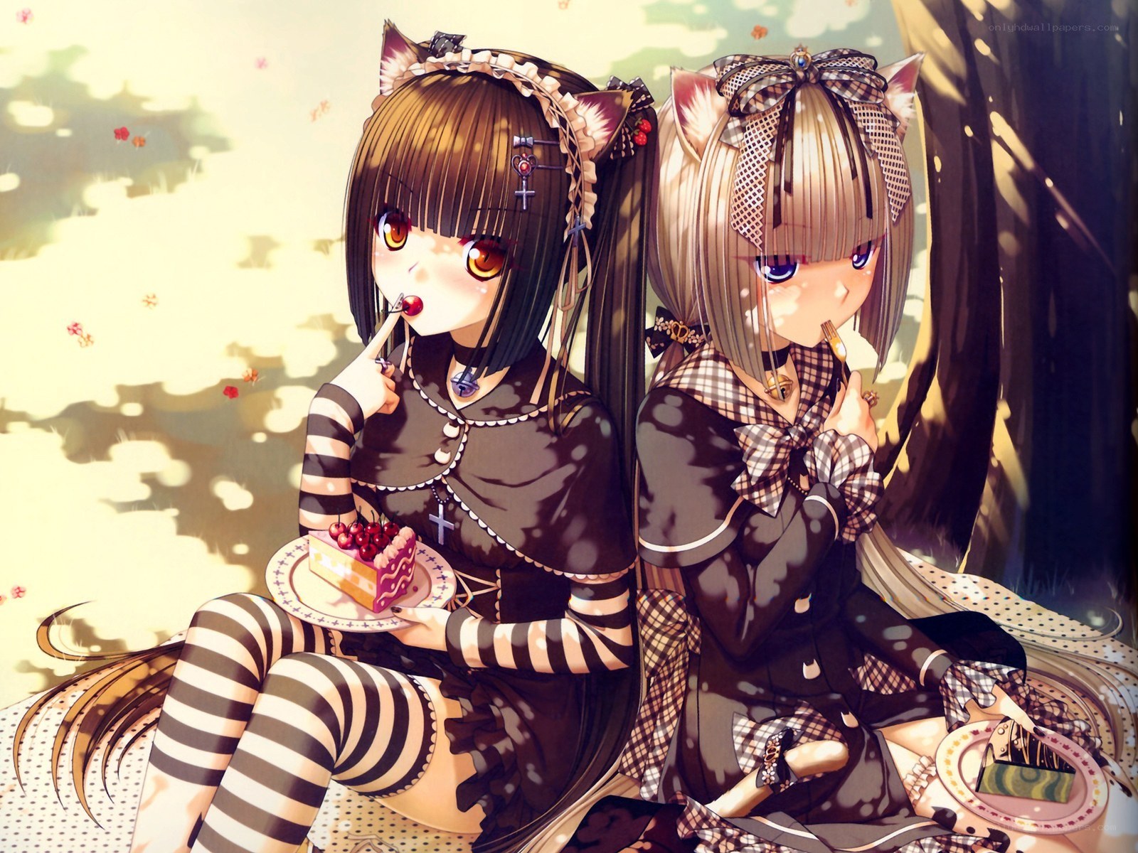 Two girls eating cake