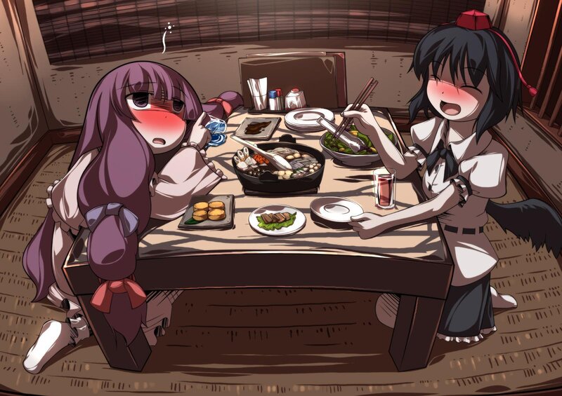 Two girls eating dinner