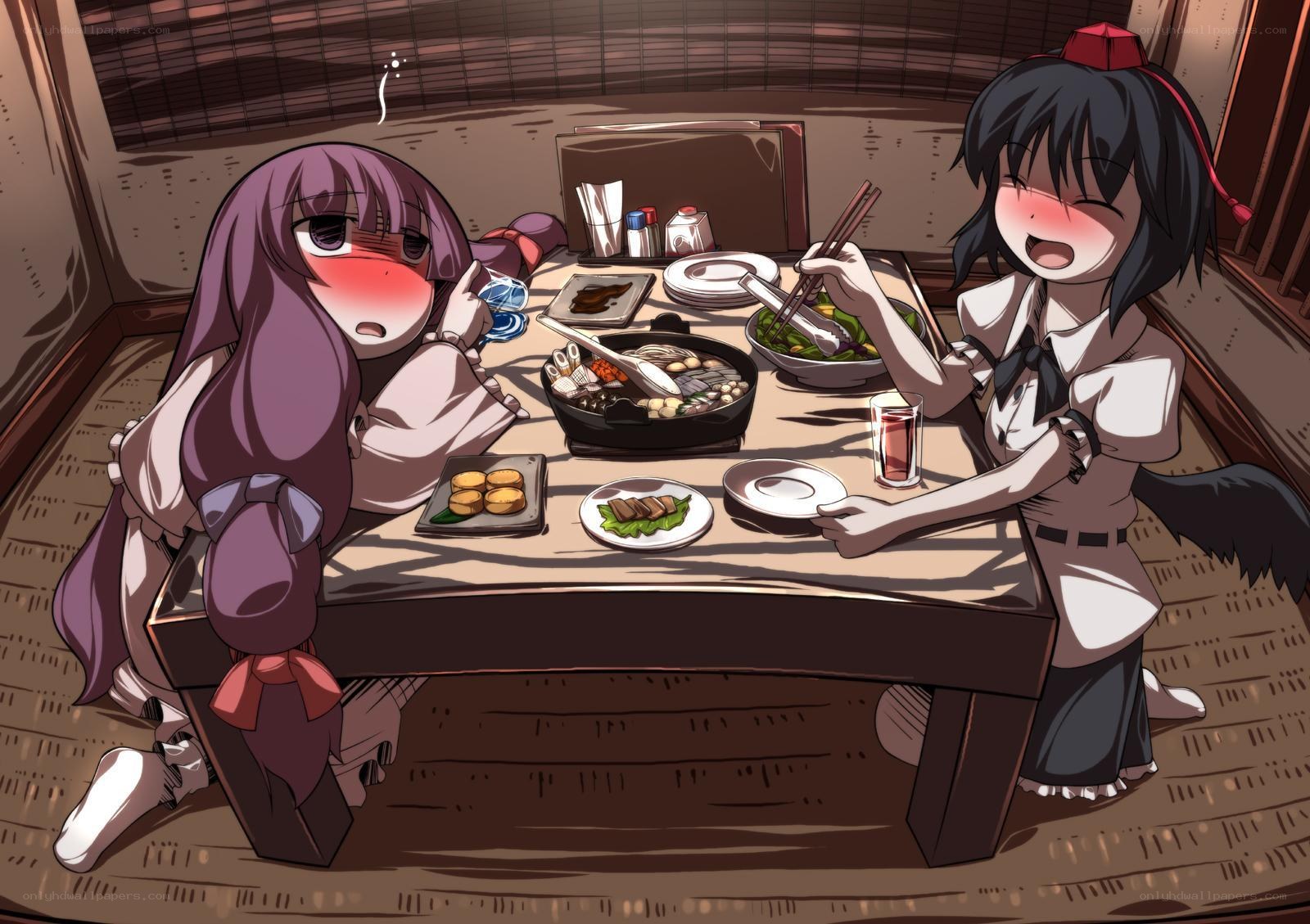 Two girls eating dinner