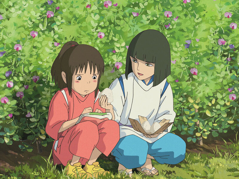 Two girls eating in a garden