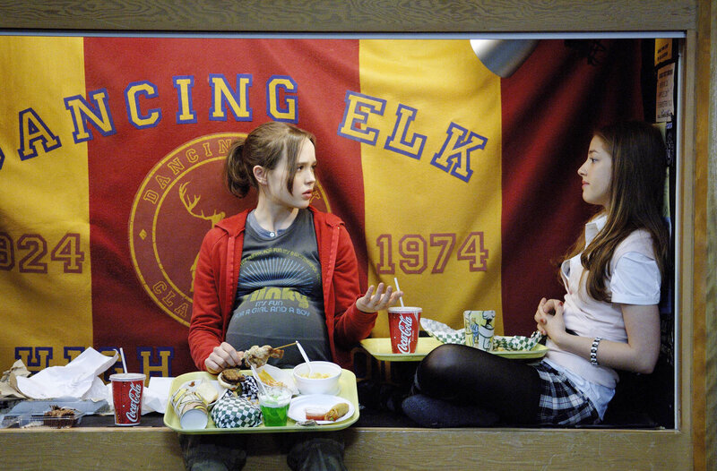 Two girls eating in a school booth