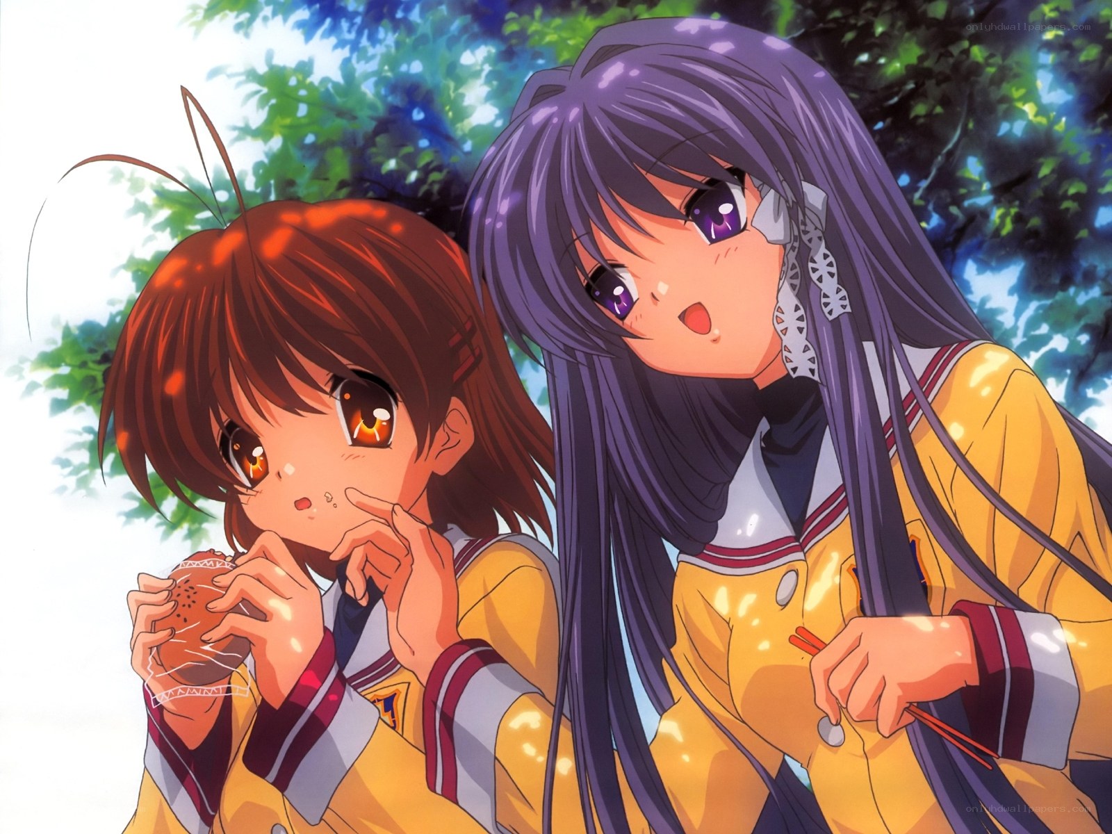 two girls eating outdoors