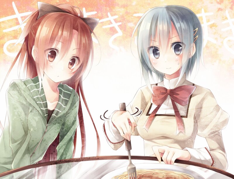 Two girls eating pasta together