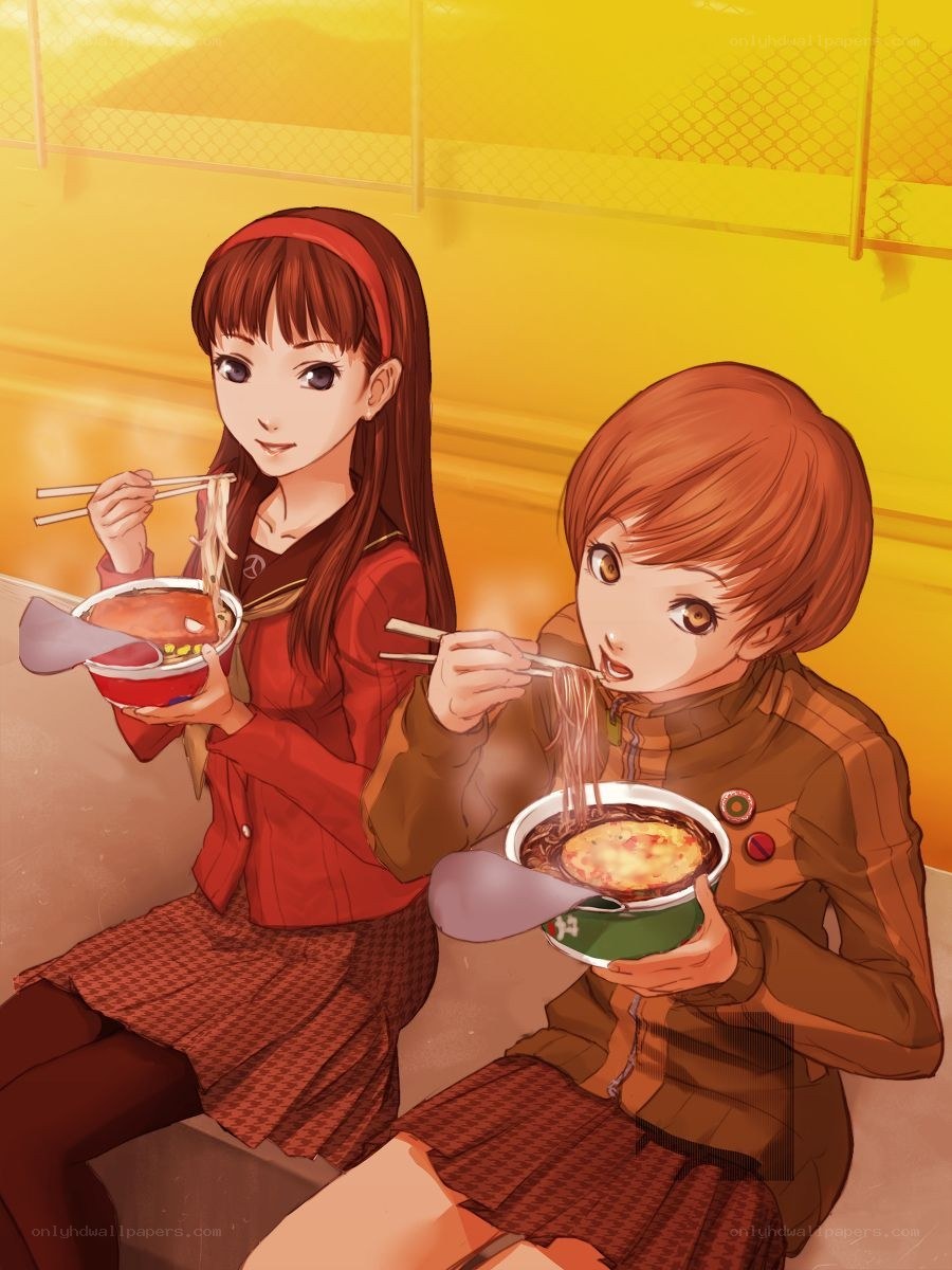 Two girls eating ramen