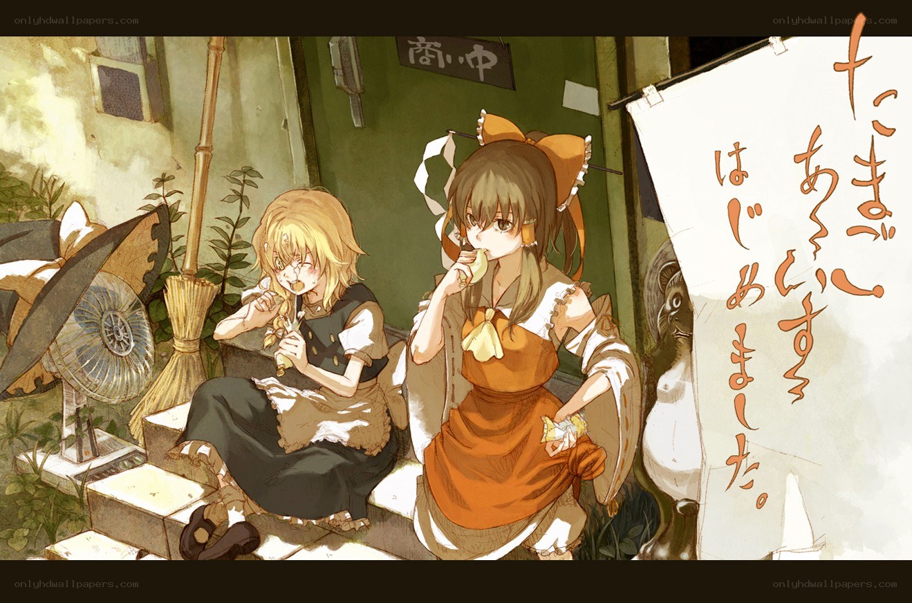 Two girls eating snacks outside