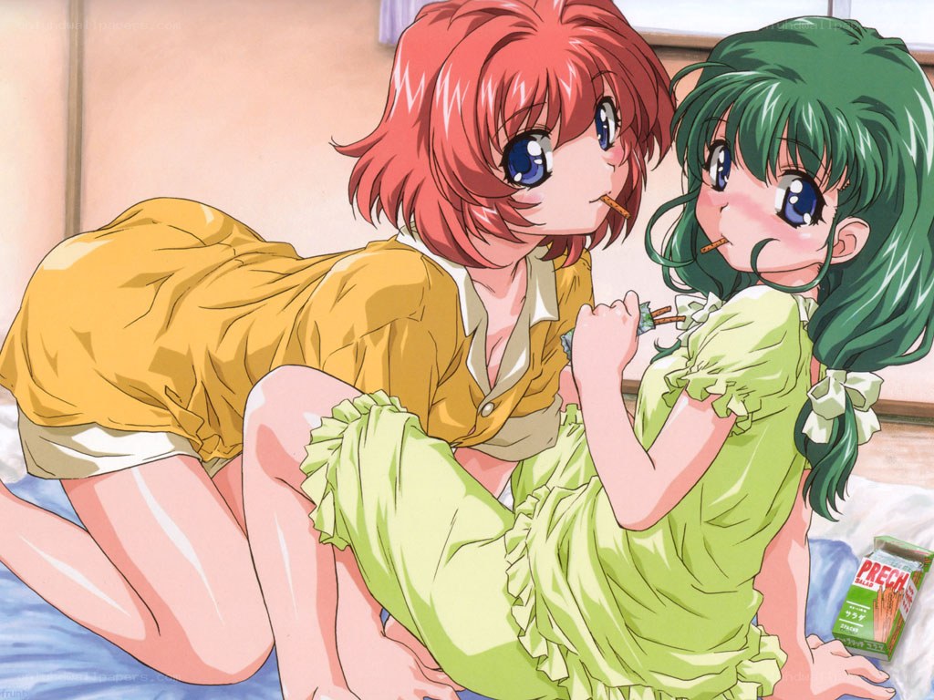 Two girls eating snacks