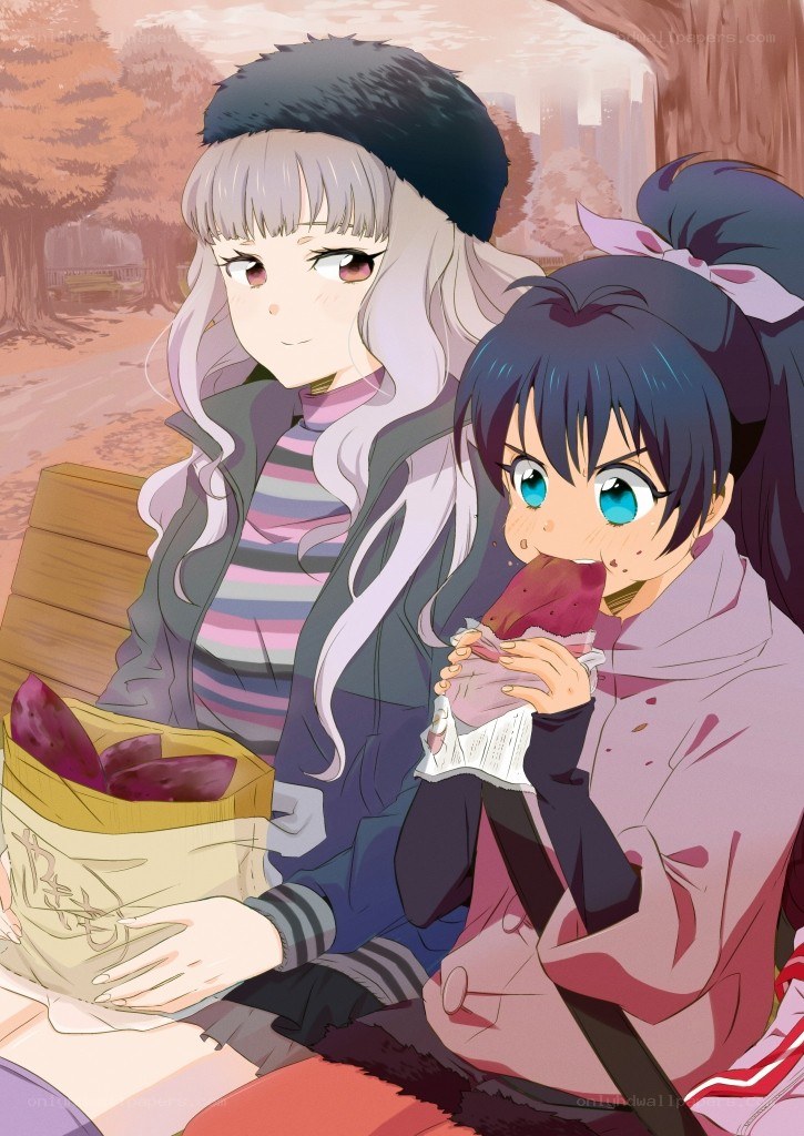 Two girls eating sweet potatoes