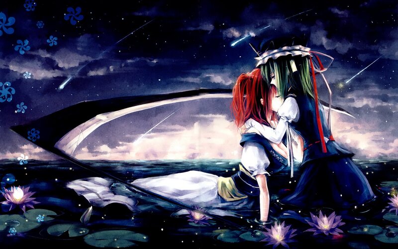 Two girls embrace on a boat
