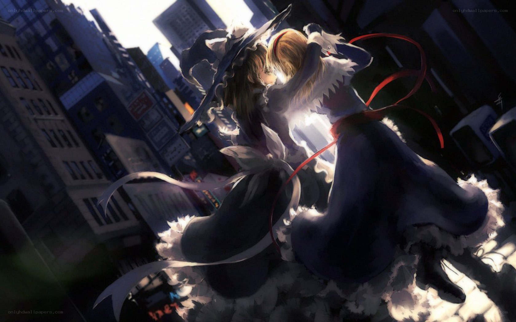 Two girls embracing in a city