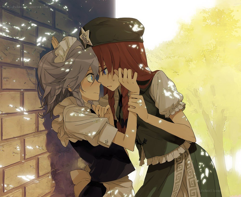 Two girls embracing in sunlight