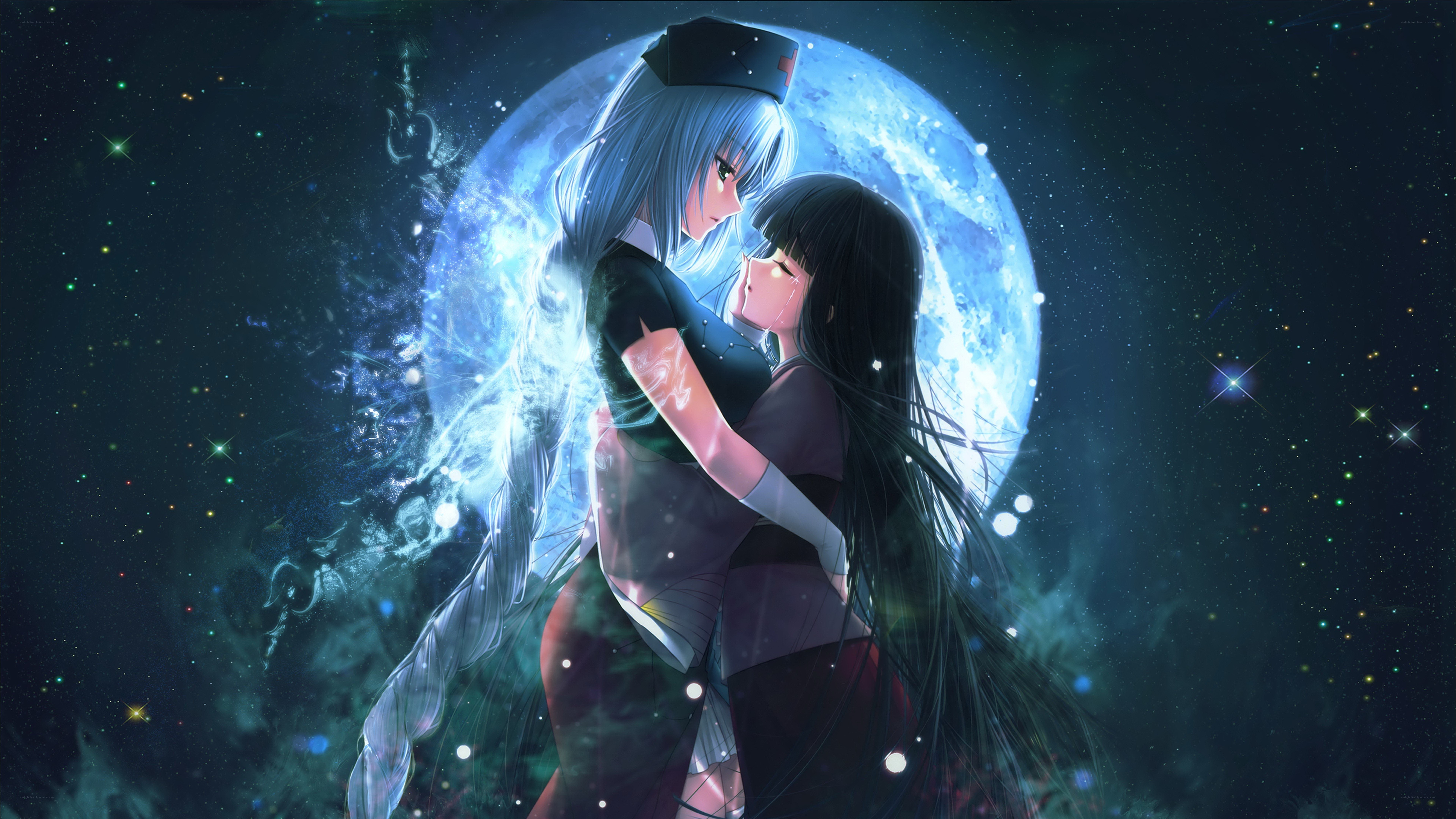 two girls embracing under a moon