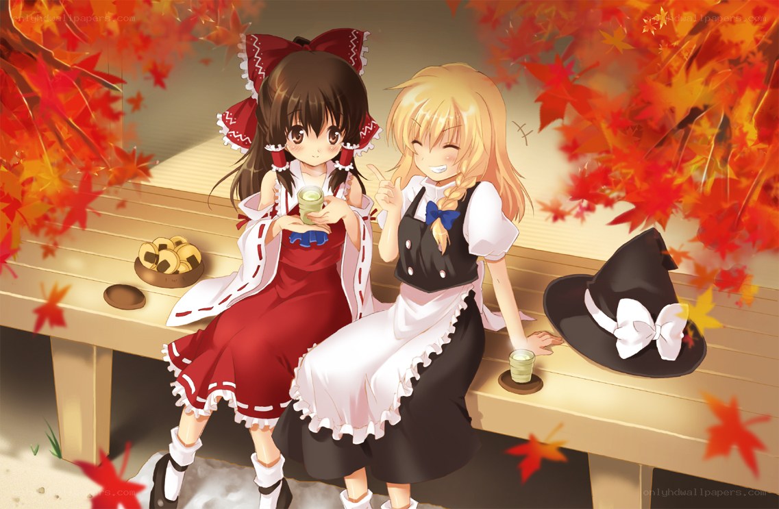 Two girls enjoying autumn tea