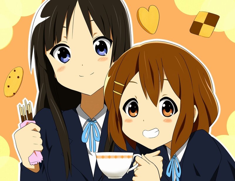 Two girls enjoying tea and snacks