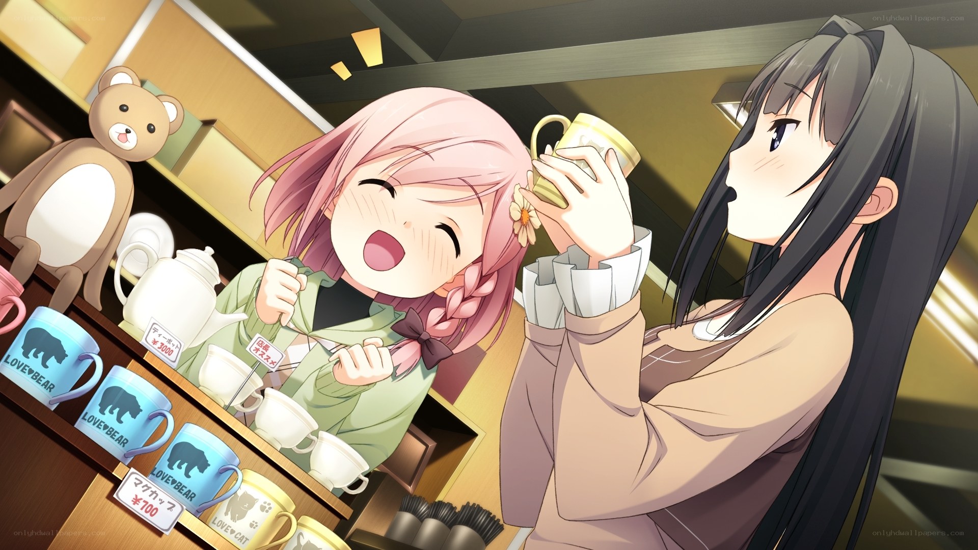 Two girls enjoying tea together