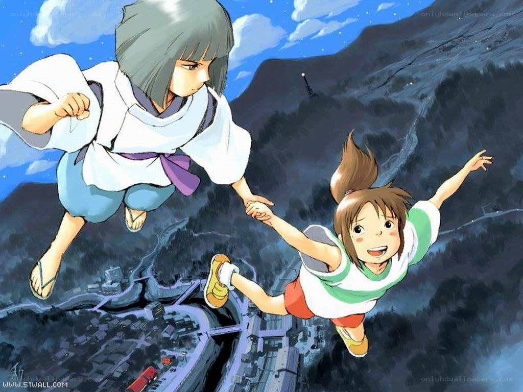 Two girls flying over a town