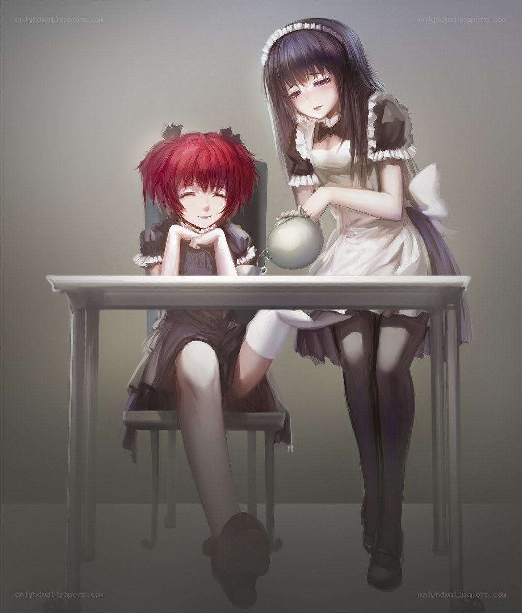 Two girls having tea
