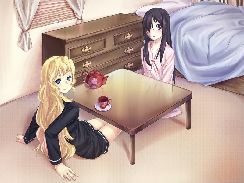 Two girls having tea in a bedroom