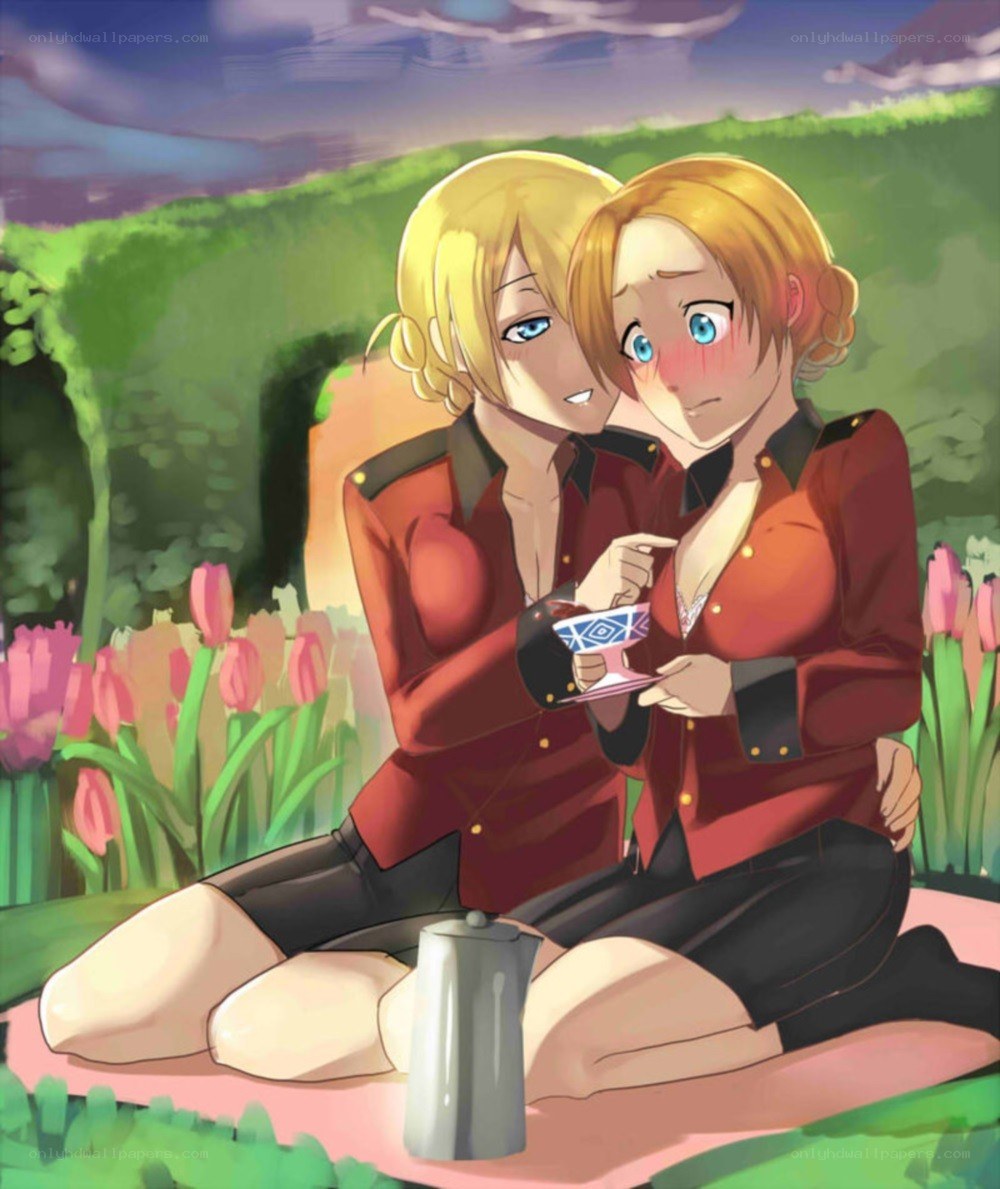 Two girls having tea in a garden