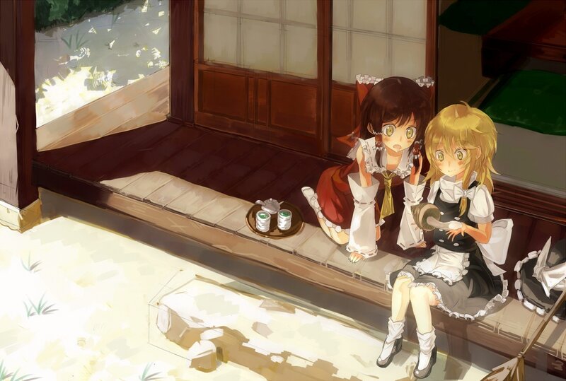 Two girls having tea on a porch