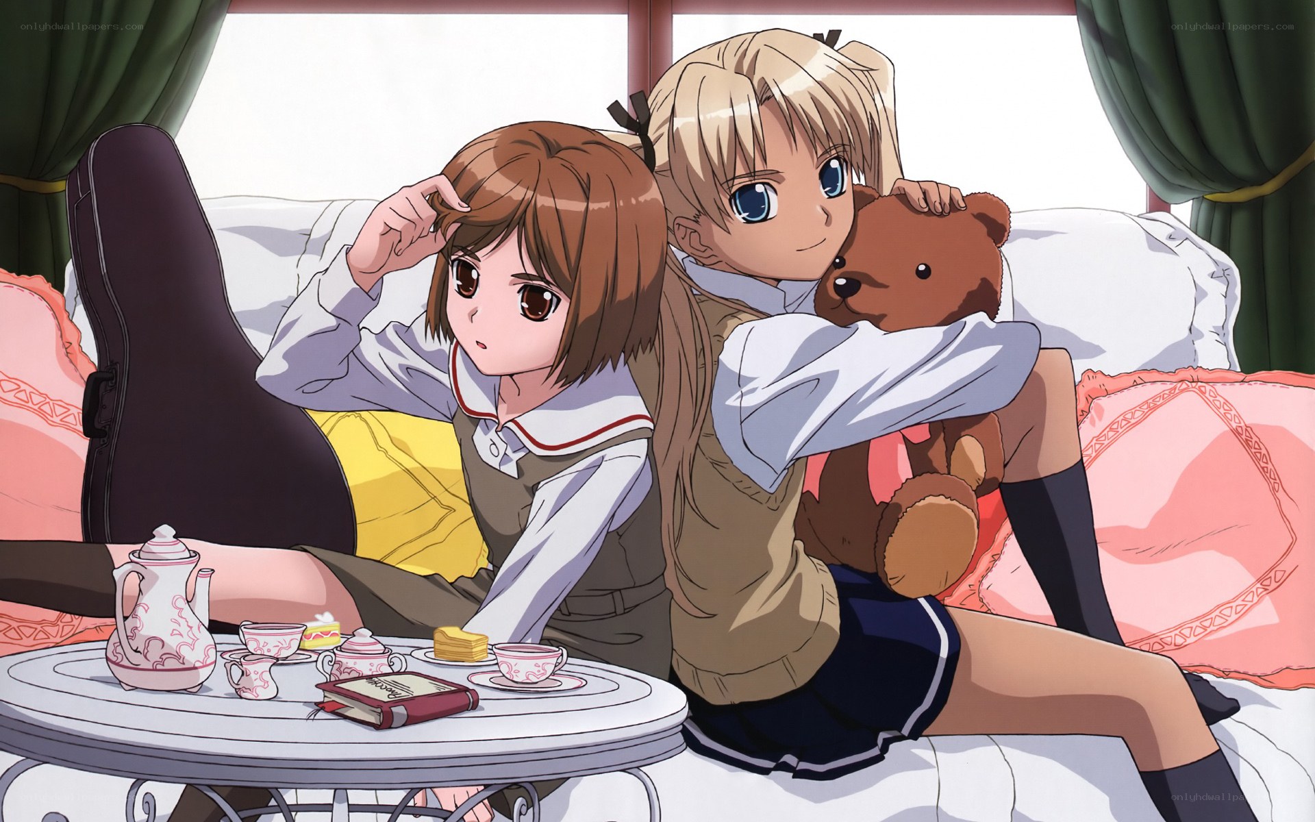 Two girls having tea time