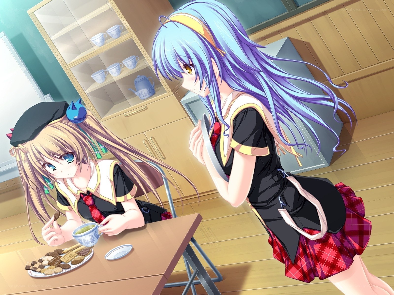 Two girls having tea time