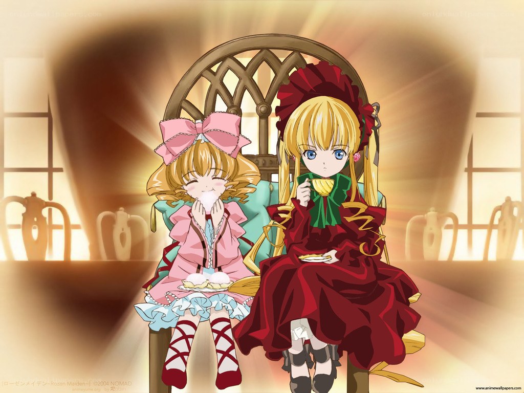 Two girls having tea together