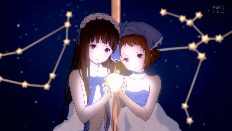 two girls holding a glowing orb