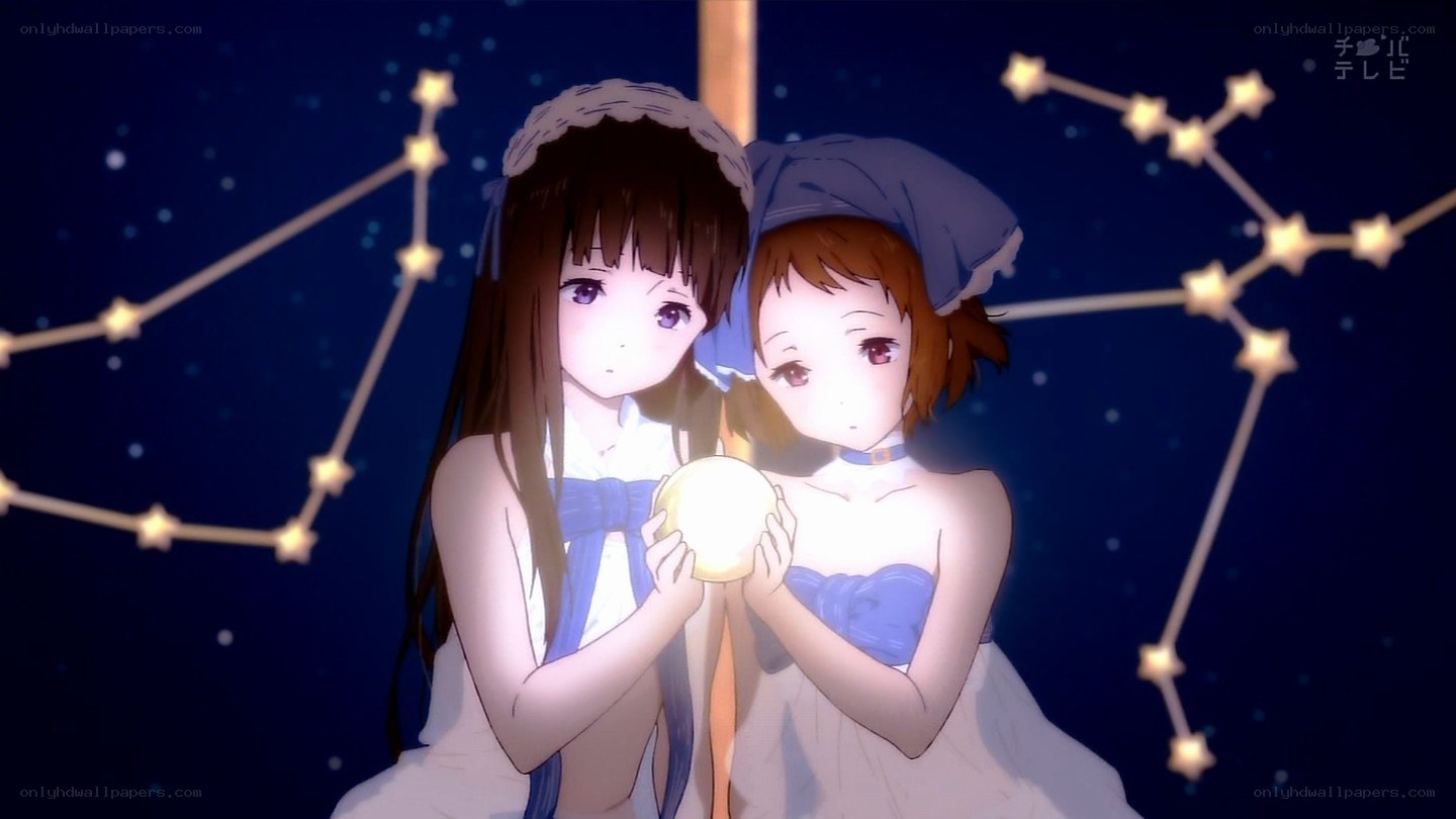 two girls holding a glowing orb
