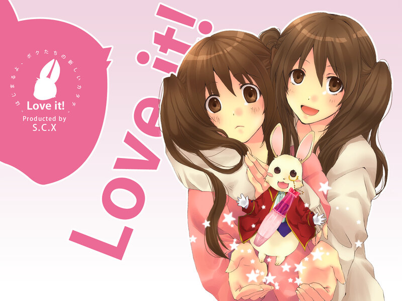 Two Girls Holding a Rabbit