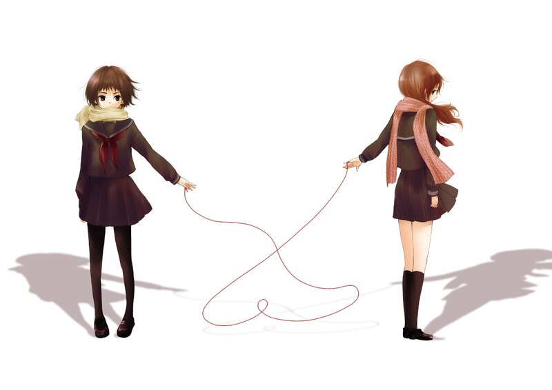 Two girls holding a red string