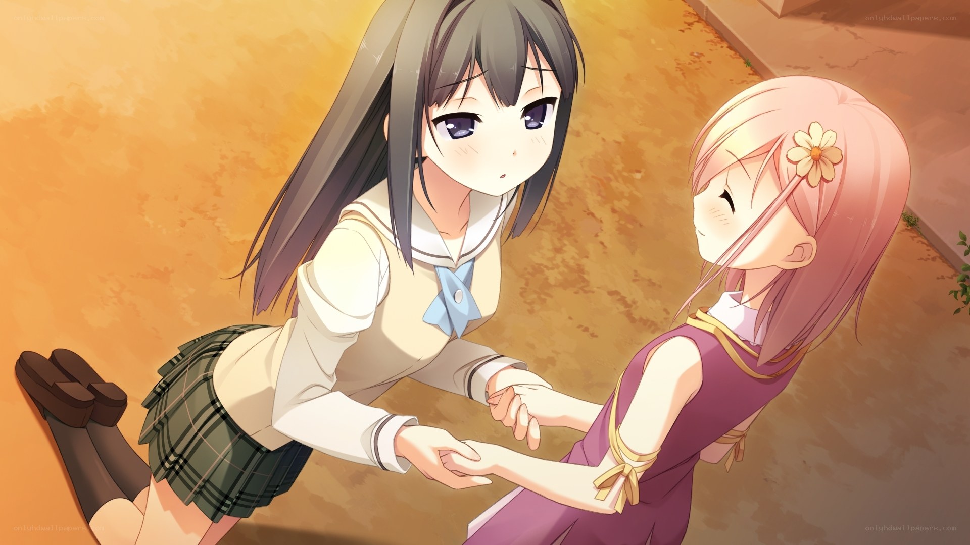 Two girls holding hands