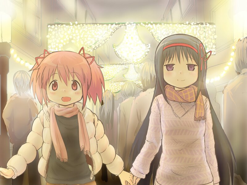 Two girls holding hands at night market