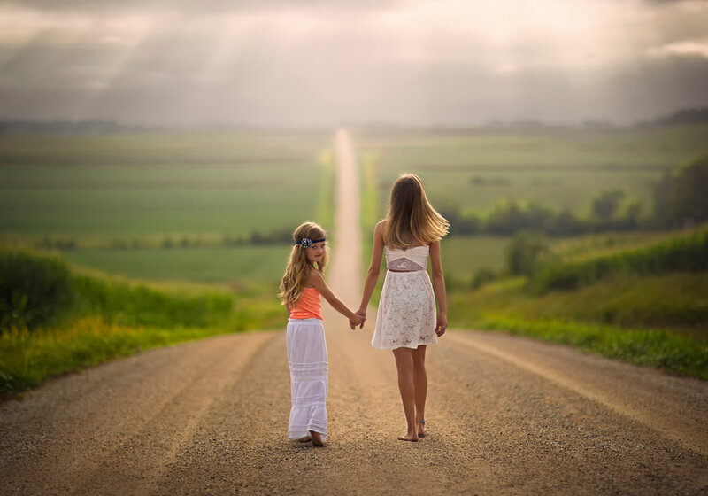 Two Girls Holding Hands — Green, Serene, Sunset