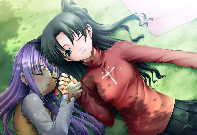 Two girls holding hands in a field