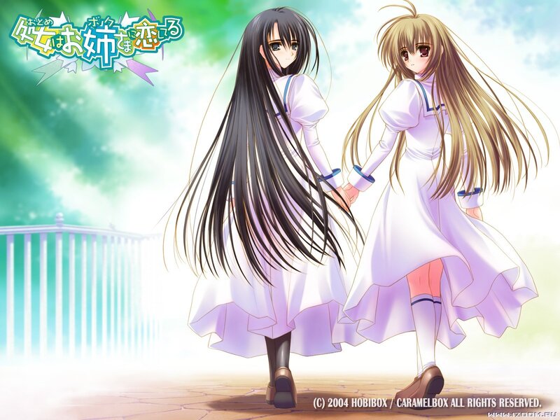 Two girls holding hands in a garden