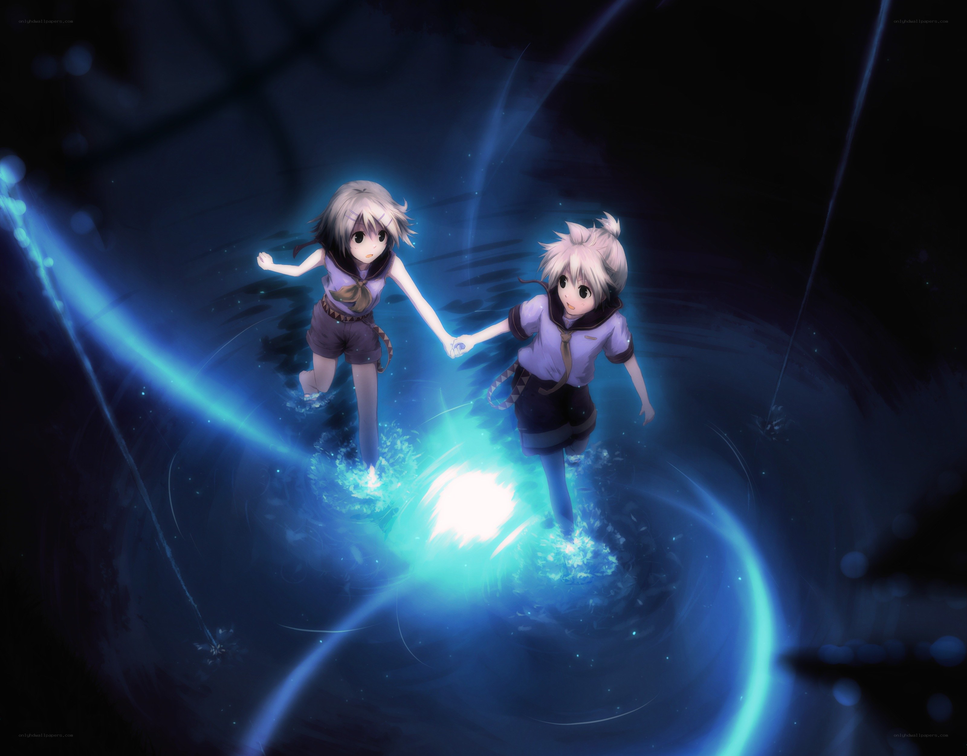 two girls holding hands in light