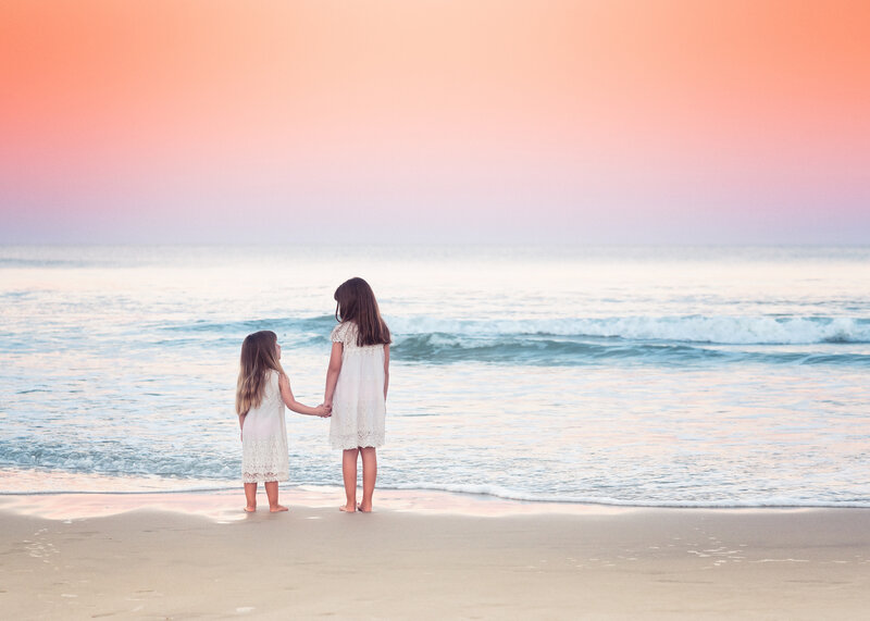 Two Girls Holding Hands — Pink, Serene, Sunset, Photograph, Beach